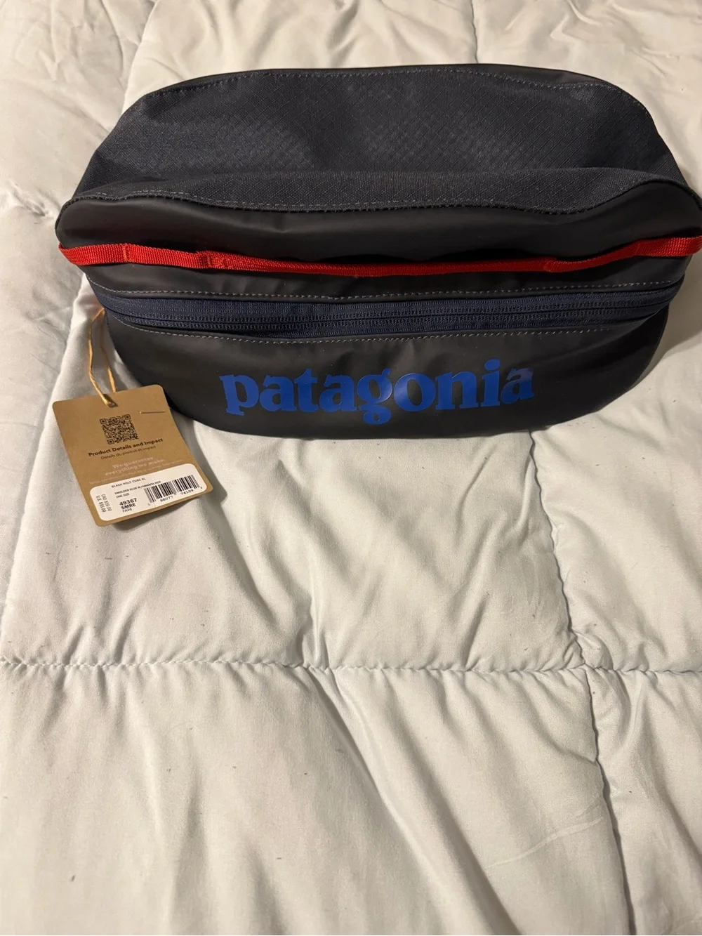 Patagonia Black Toiletry Bag with Blue Logo and Red Trim